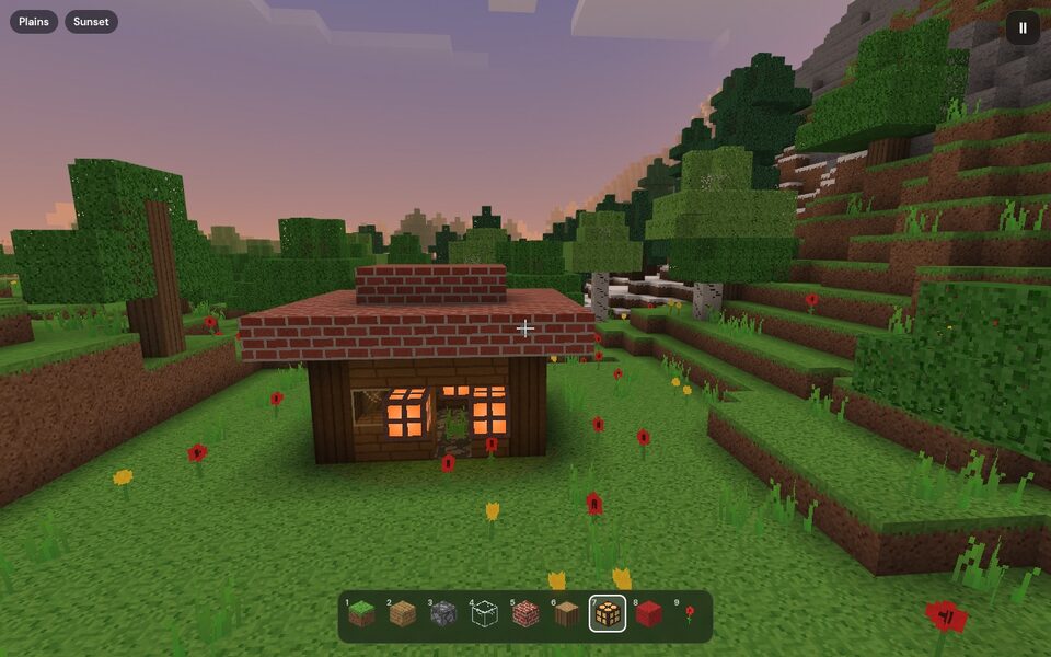 A 3D block world with mountains and a lake