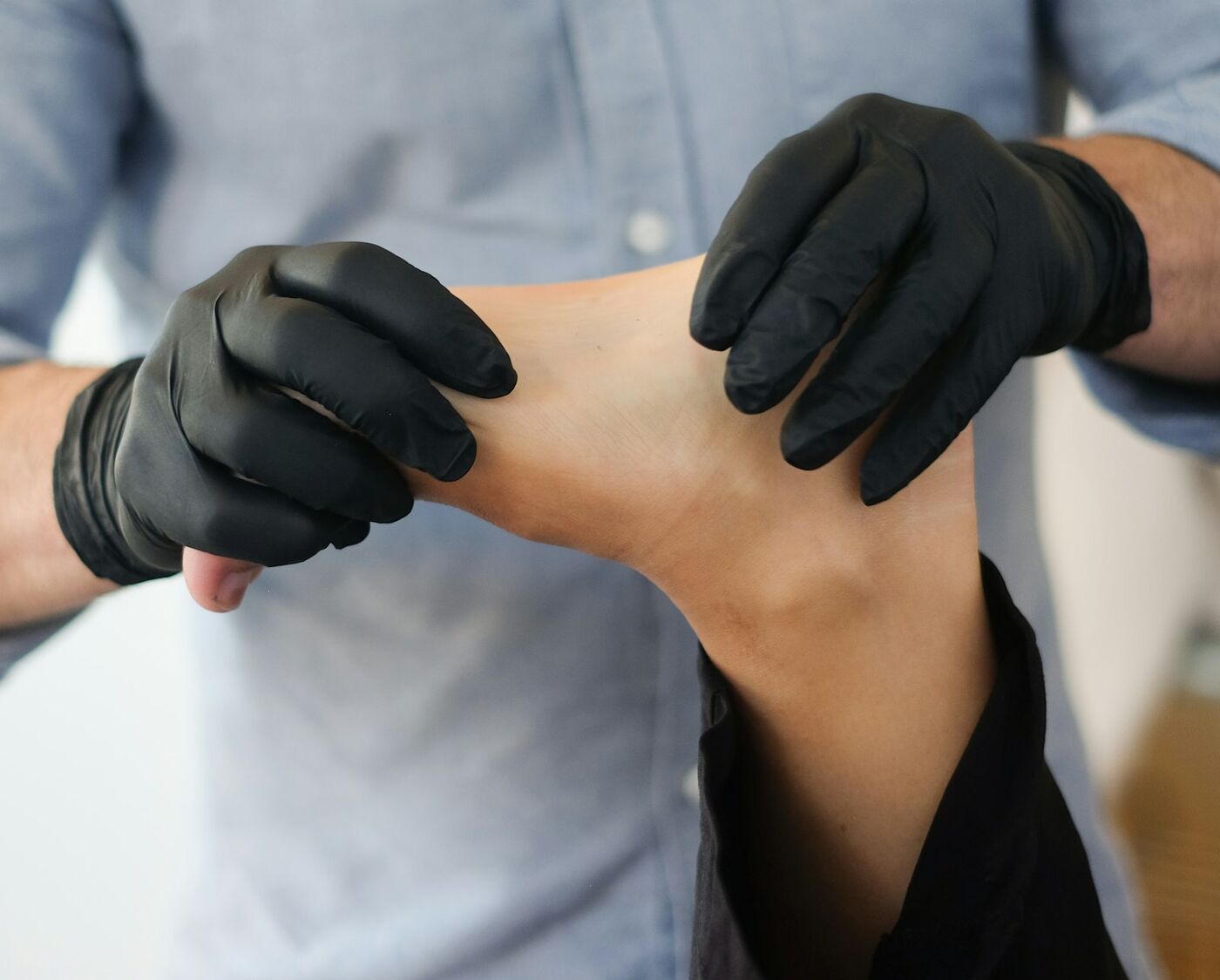 A physiotherapist working on a patient's neck and shoulder
